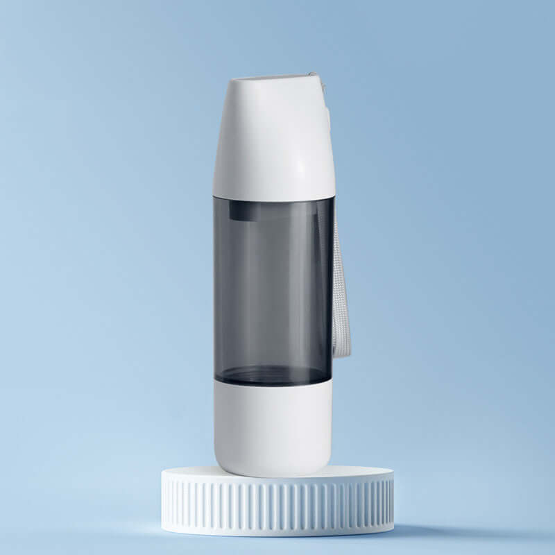 PELOSETTINSHOP Portable Dog Water Bottle 350ml in sleek design on a blue background.